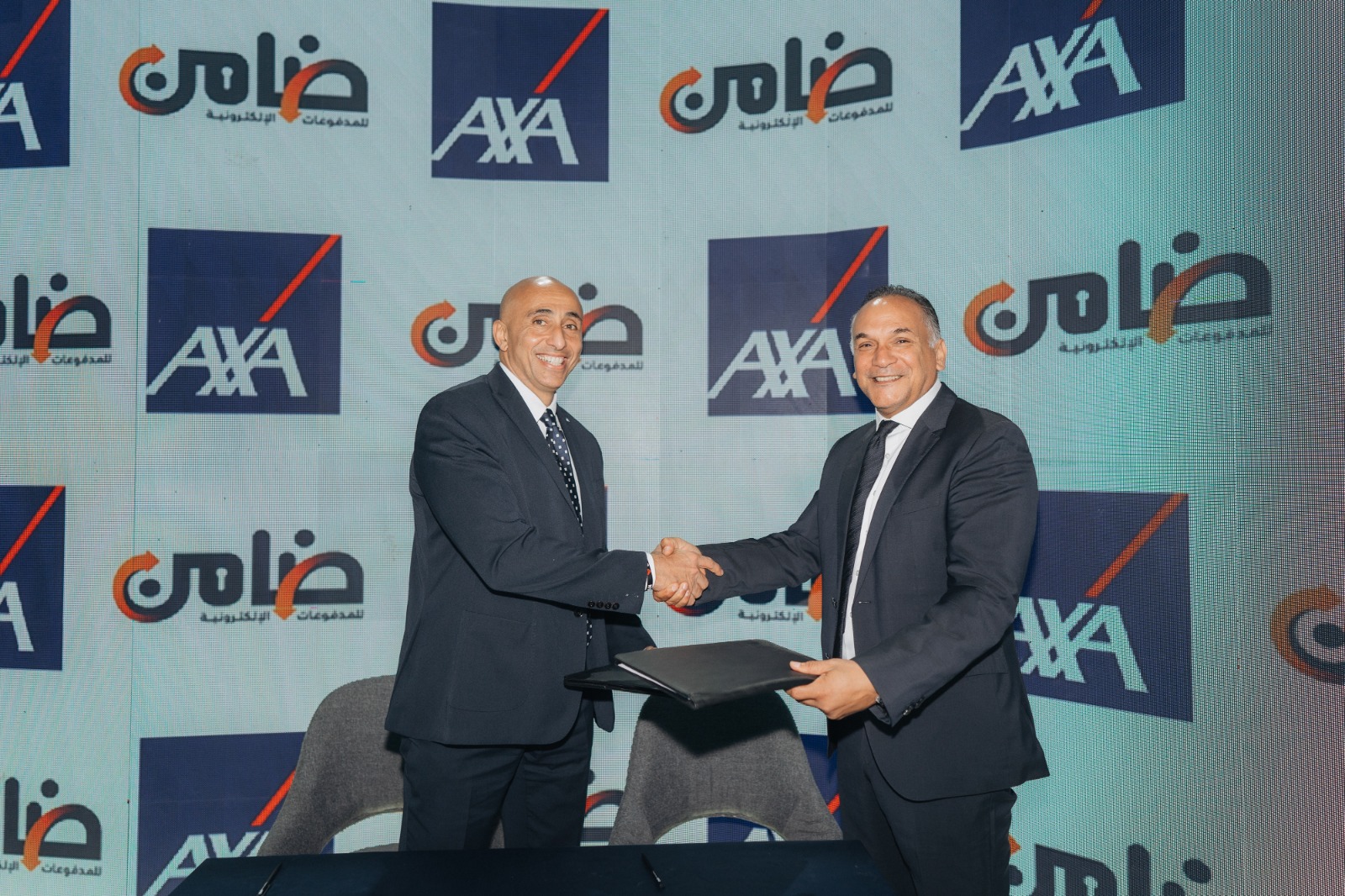 «ضامن» توقع عقدًا مع «أكسا»