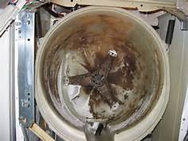 smelly HE front loading washer, mildew smell sports clothes, T shirts ,towels, spots/stains after the clothes washed, Black mold rubber door gasket,
