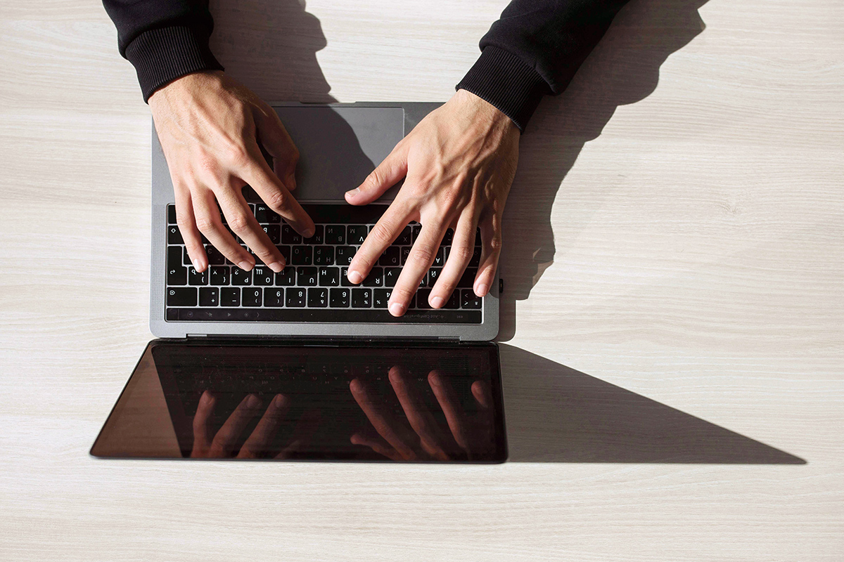 Contact us, hands typing