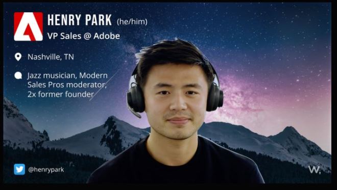 Head and shoulders of a man attending a virtual meeting with a virtual background