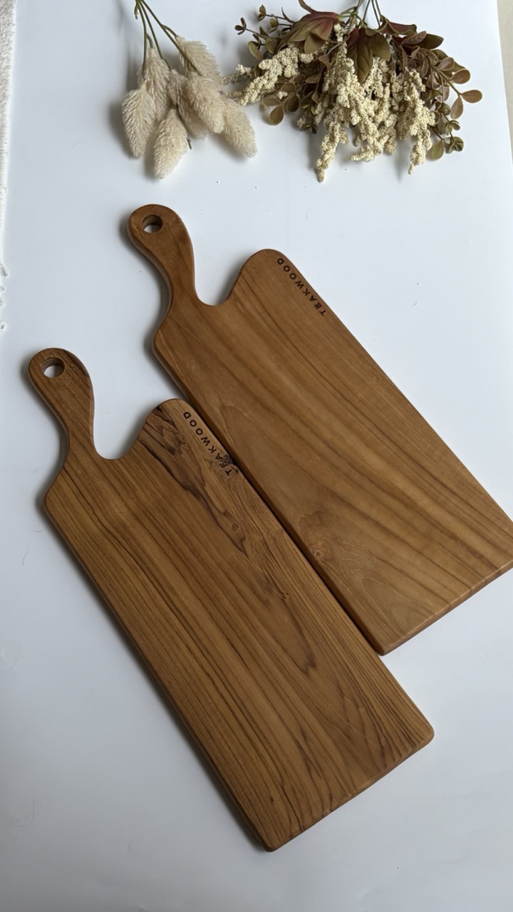 Teak serving tools in a calm natural kitchen