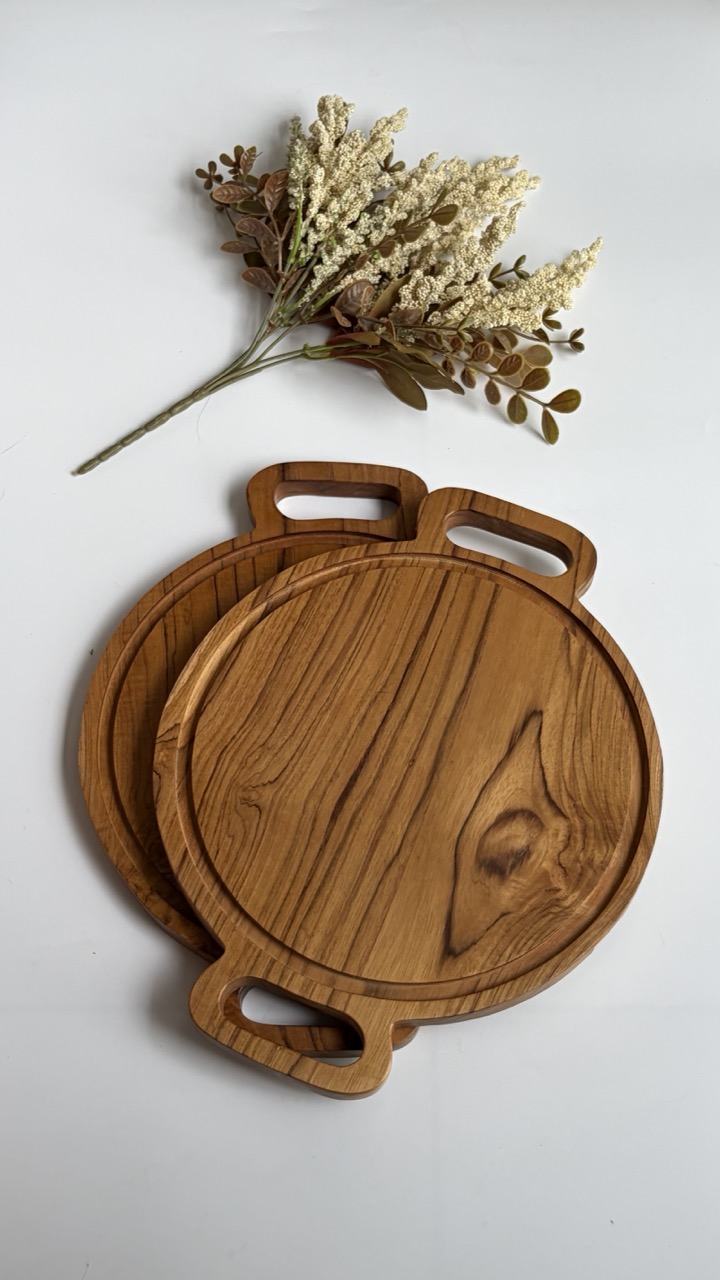 Handcrafted teak boards, bowls and serving utensils