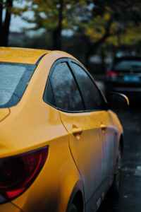closeup photography of yellow car