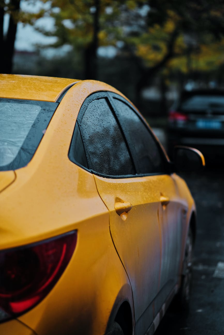 closeup photography of yellow car