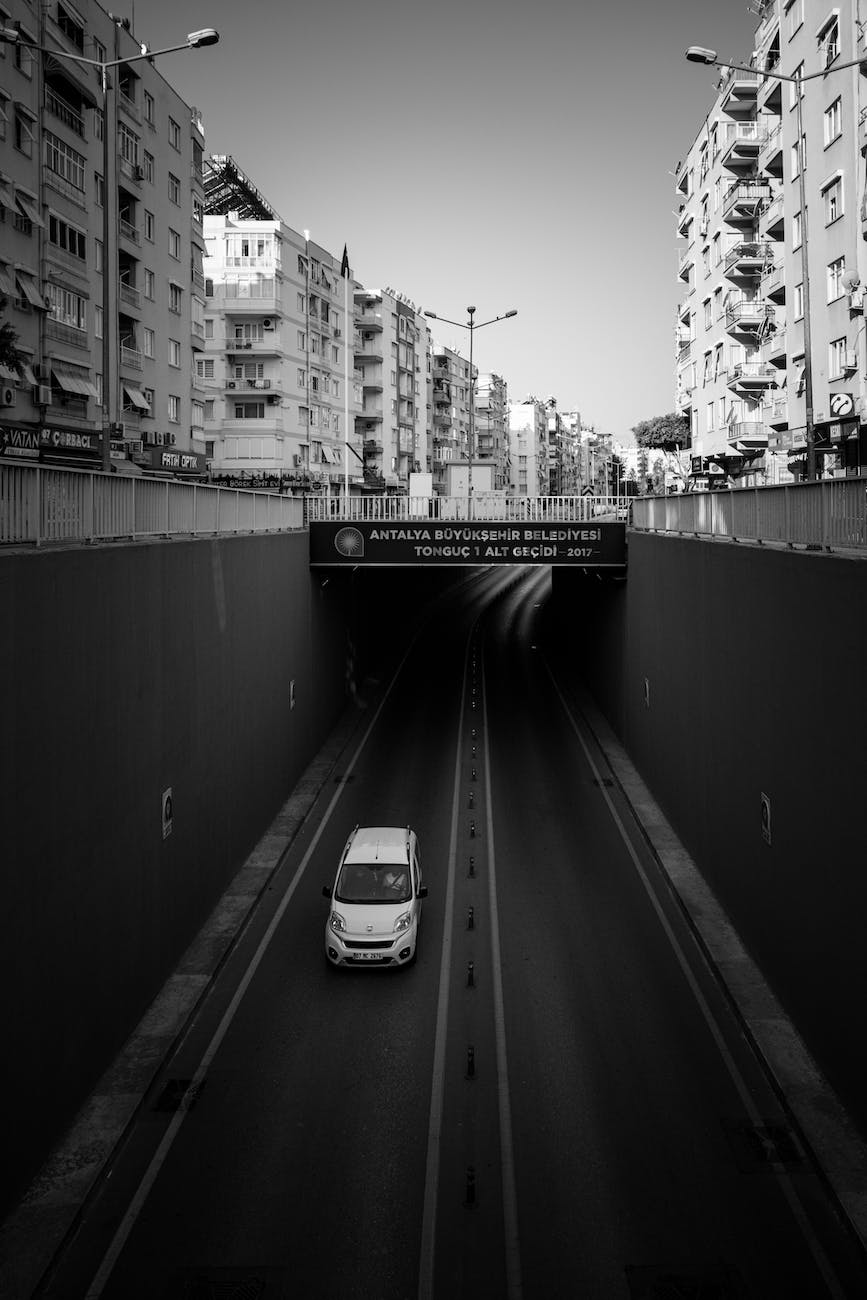 a car driving out of a tunnel in city