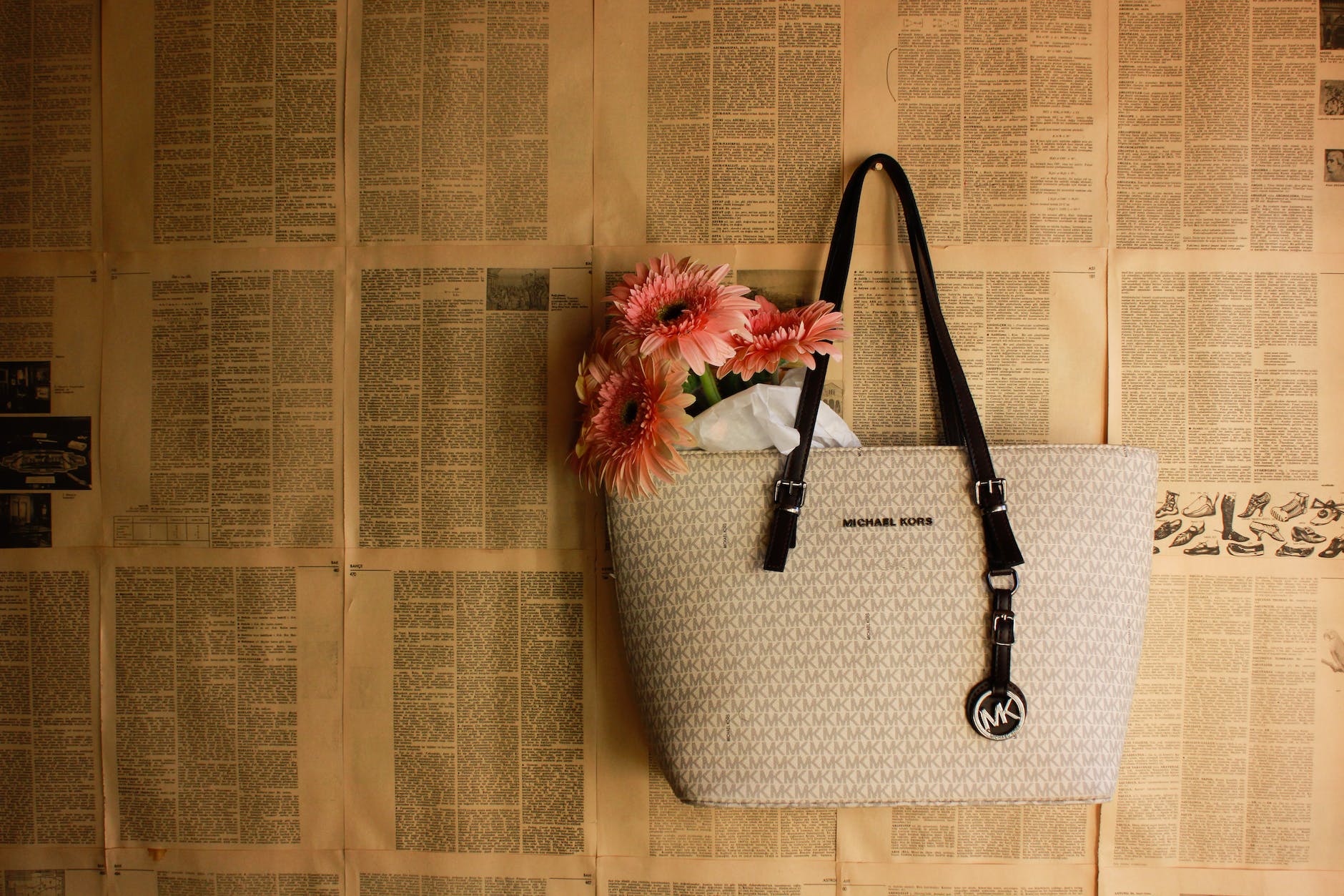 daisies in a michael kors handbag