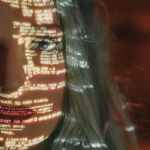 woman with text projected on her face