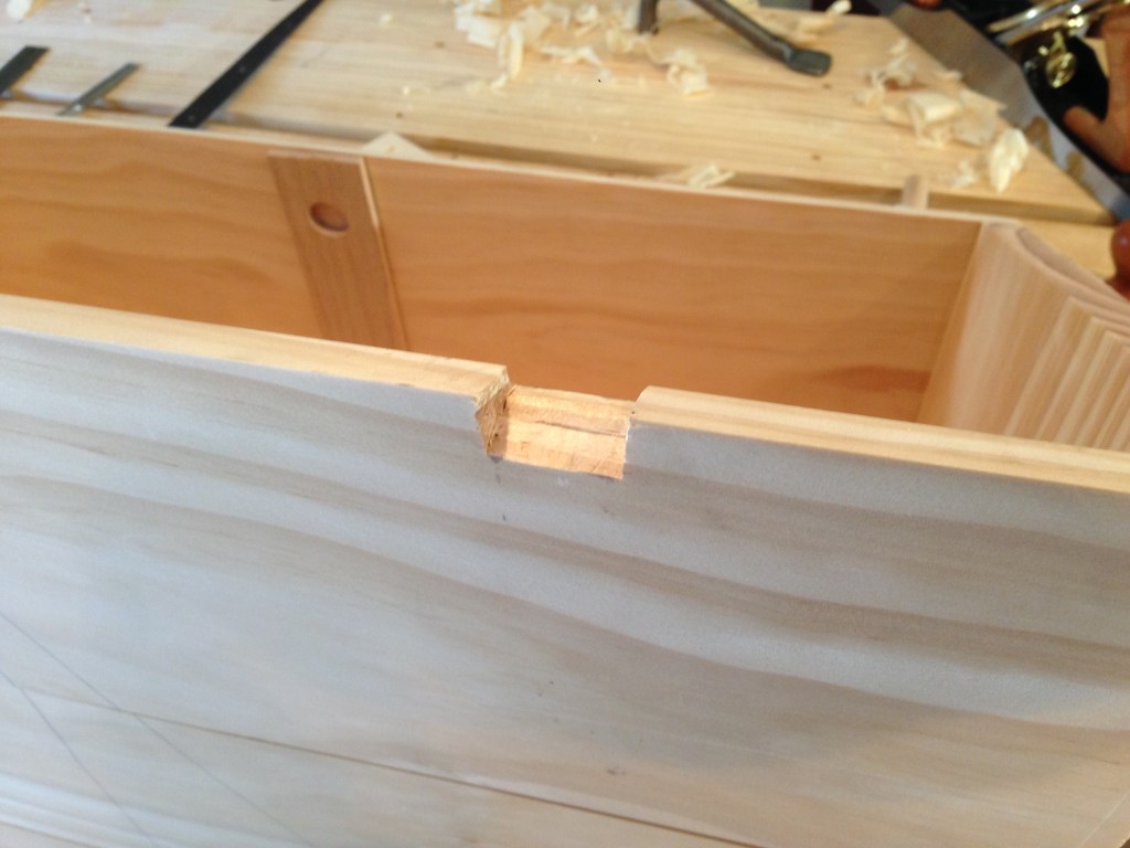 The mortise on the back of the chest that will house the barrel of the hinge.