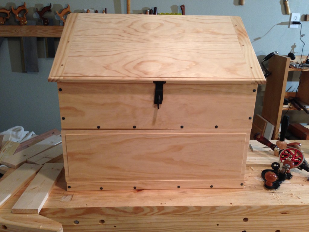 Hardware installed on the nearly completed chest.