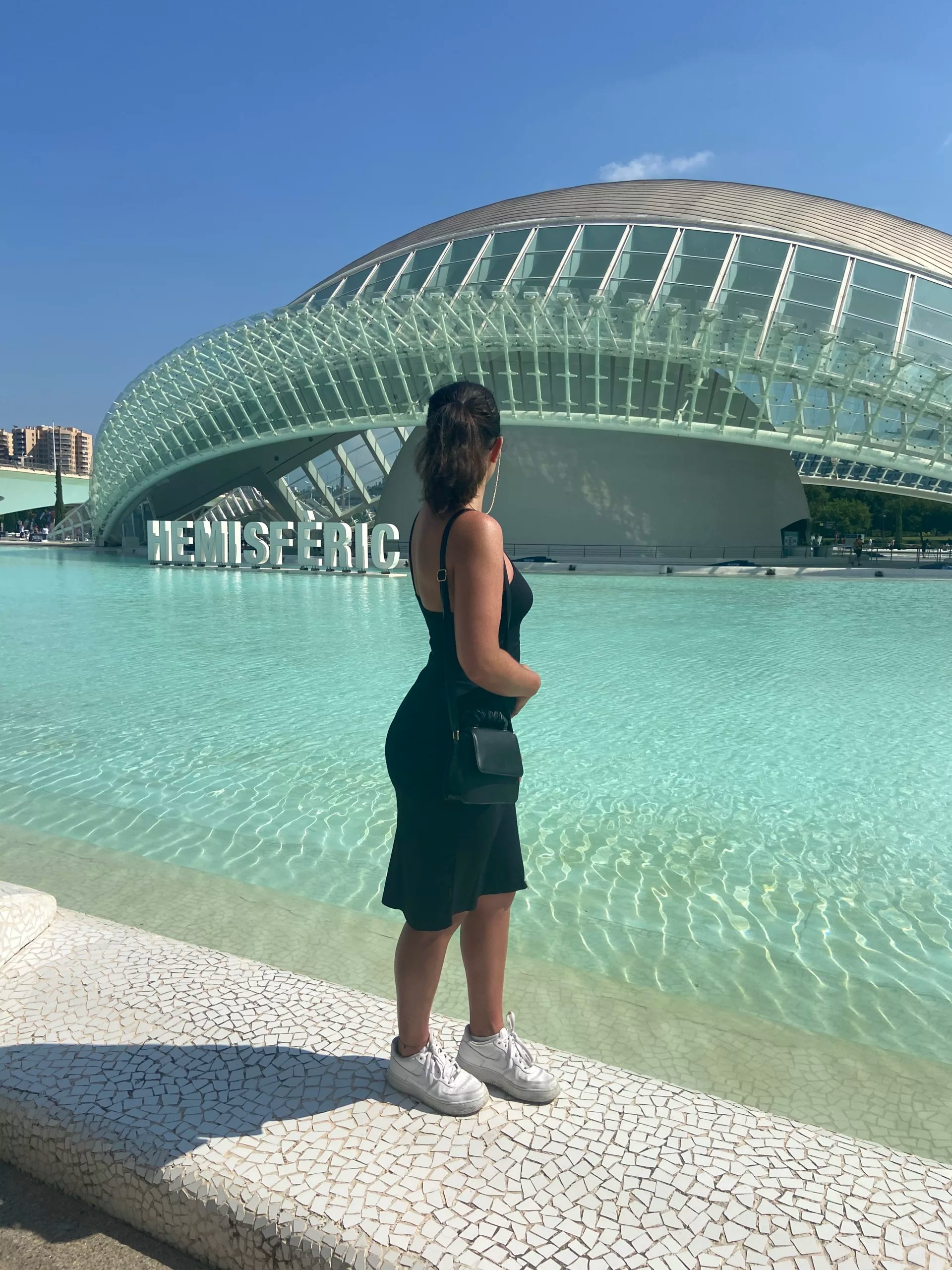 a girl in front of the hemisferic, Valencia Spain