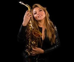 From the barrios of Mexico City to the big stages all over the USA and everywhere, this rockin’ lady with the big saxophone has never lost her roots…Evelyn Rubio perfect for the Unity Fest, her music perfect for our fans