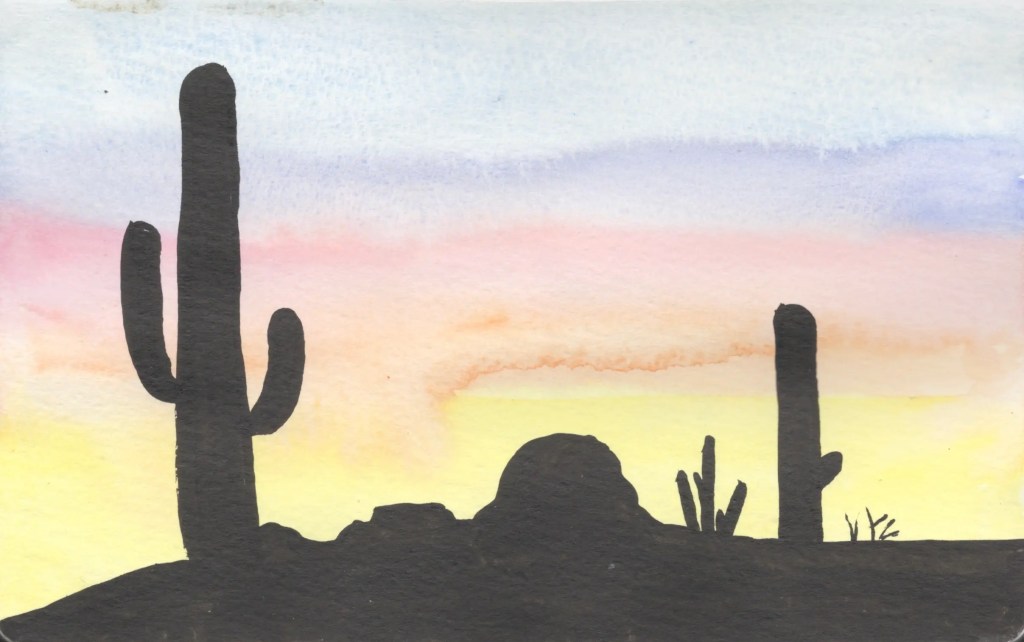 Silhouetted desert cacti and mountains against a pastel sunset sky