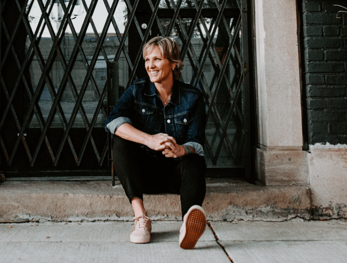 Danielle Strickland sitting on a curb