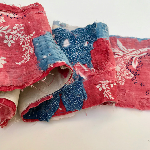 Mandy Pattullo. Red Work, 2022. Scroll book of unpicked quilt fragments, represented and joined, with surface stitching.