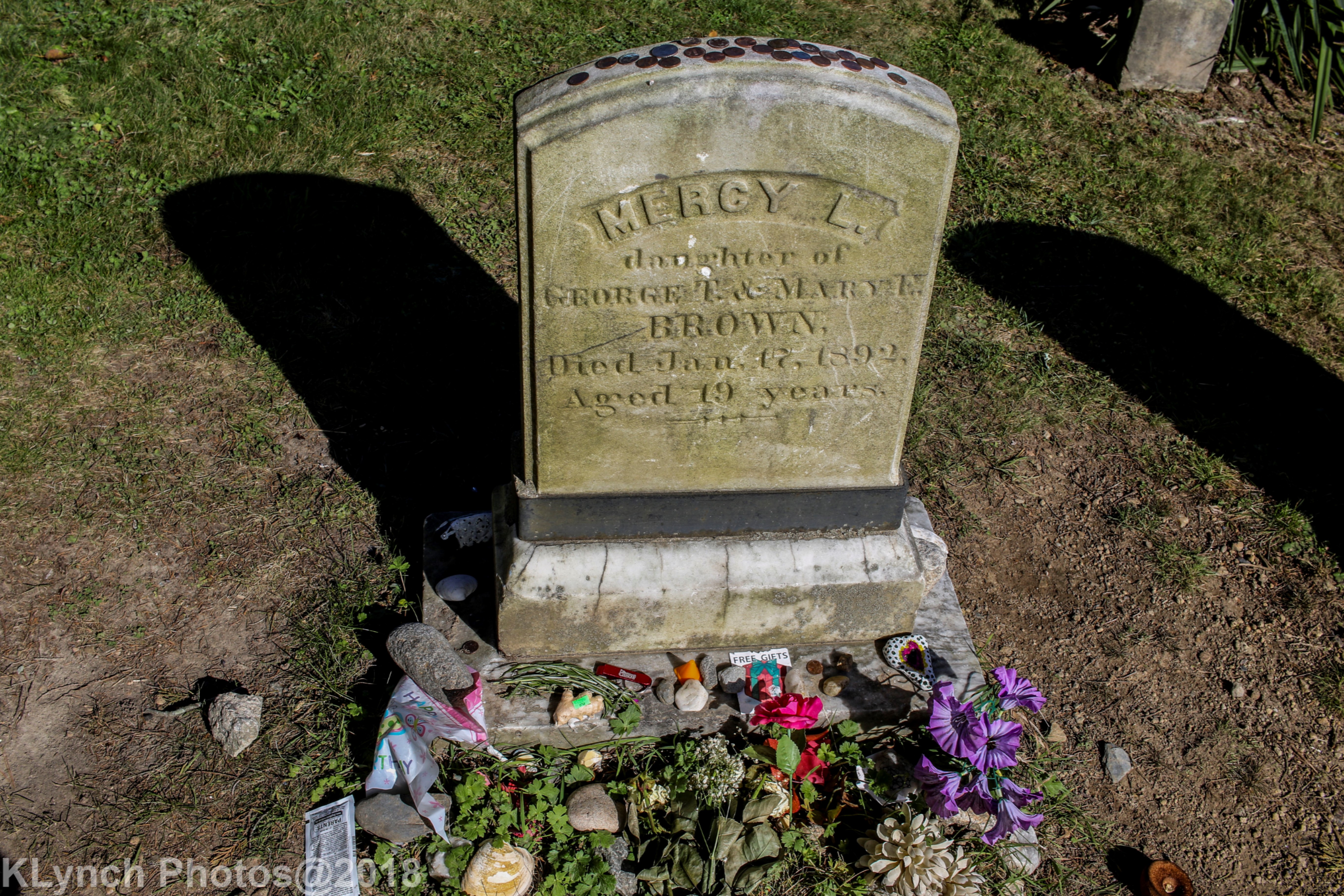 Visitors regularly place items at her grave