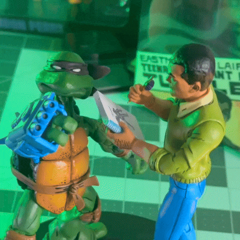 A rotating gif of the Jack Kirby and Donatello action figures together