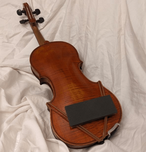 ArcRest Universal centered on a full size violin"