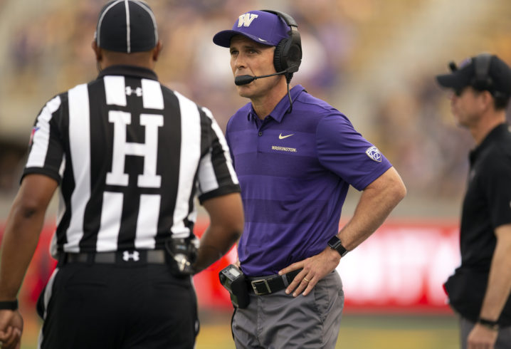 Oct 27, 2018; Berkeley, CA, USA; Washington Huskies head coach Chris Petersen, right, talks to an official during the second quarter of an NCAA football game against the California Golden Bears at California Memorial Stadium. Mandatory Credit: D. Ross Cameron-USA TODAY Sports