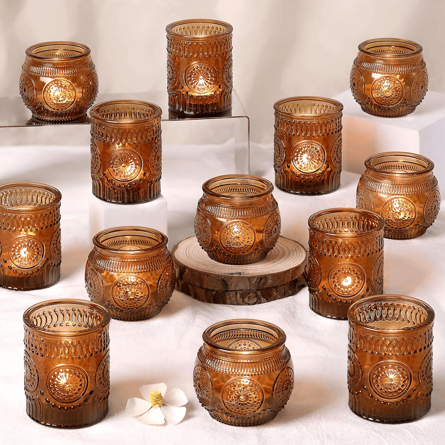 Amber tea lights adding warm glow to cozy boho Fall decor