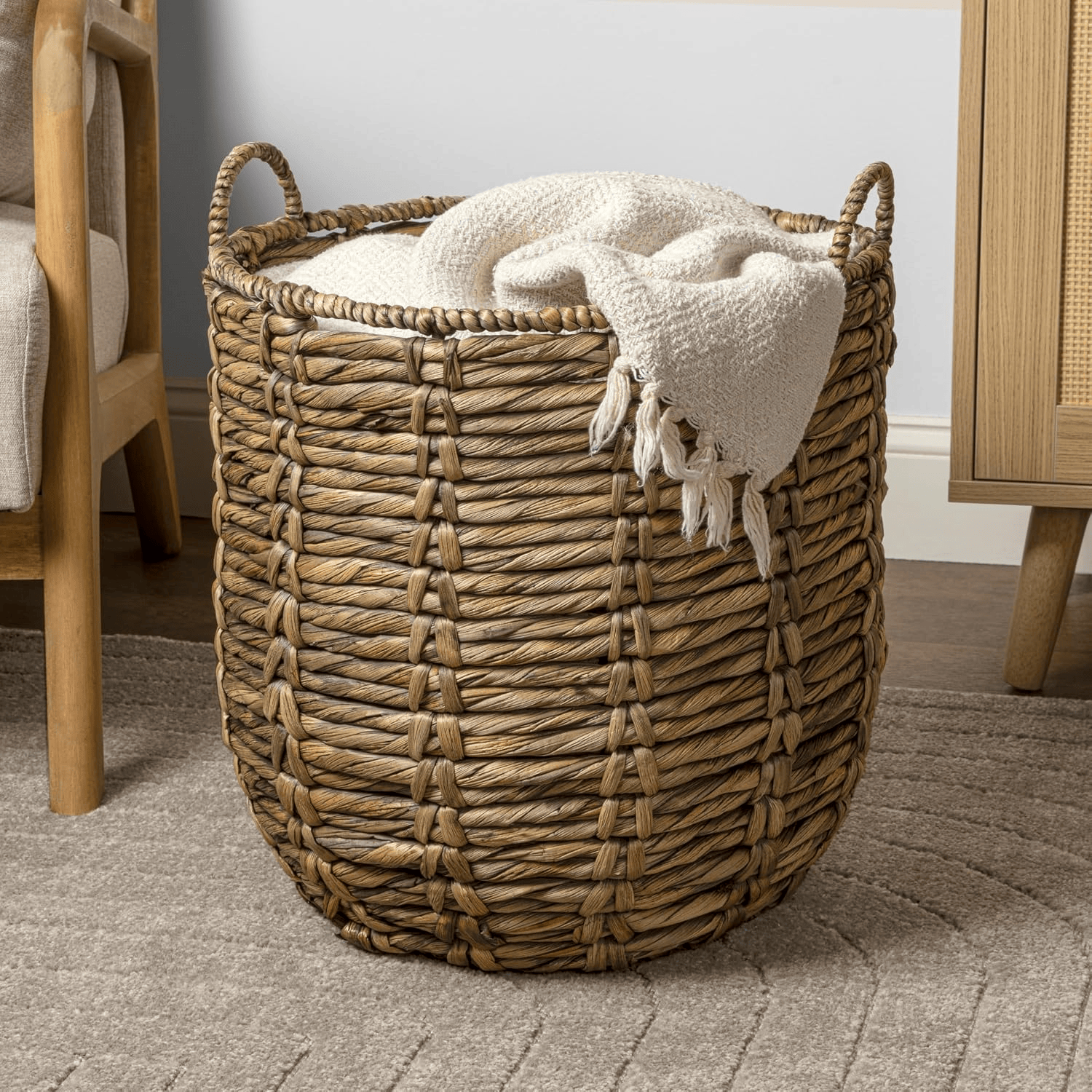 Woven basket adding natural texture to cozy boho Fall decor