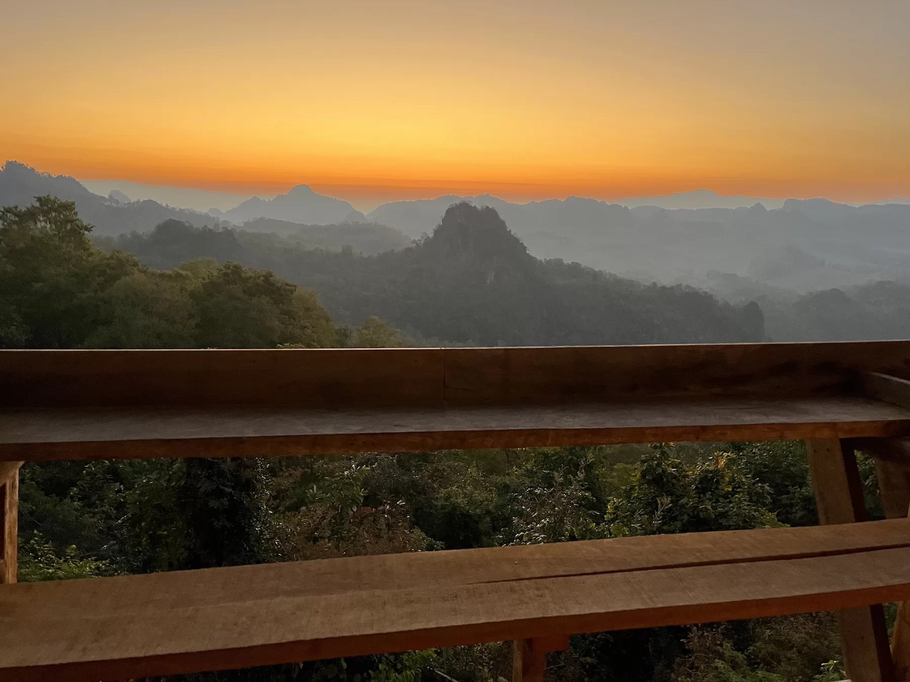 sunrise from a balcony in Ban Ja Bo village in Mae Hong Son thailand looking out at mountains