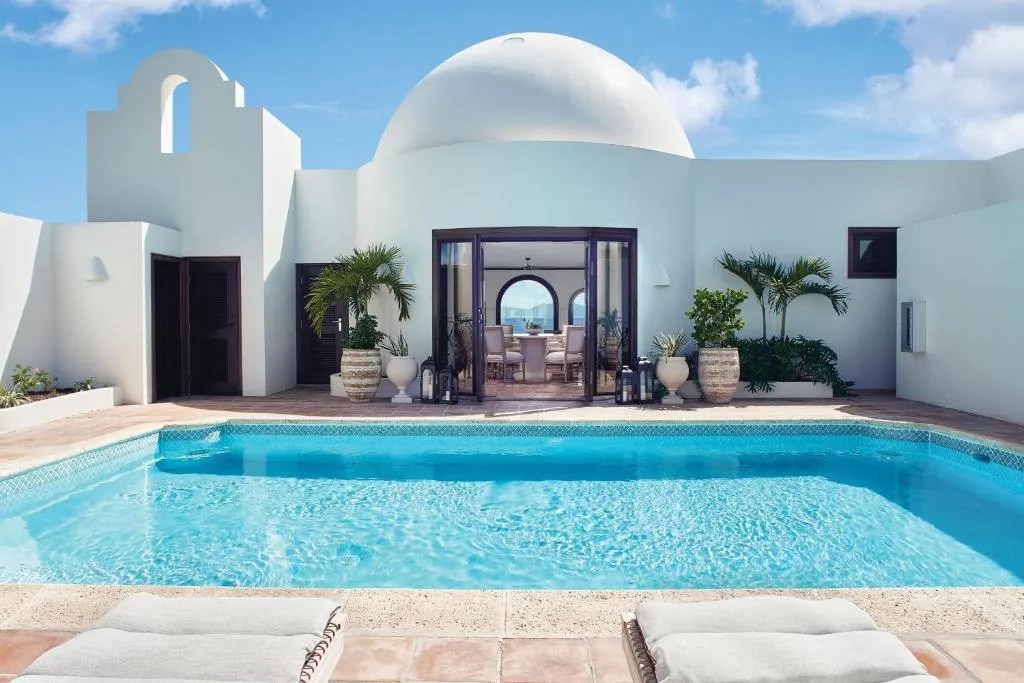 private pool in a room at the cap juluca resort in anguilla, with white mediterranean-style architecture