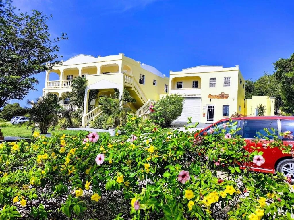 green and classic exterior of littlelux living in anguilla