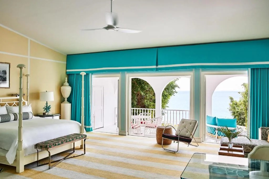 a beautiful and colorful room overlooking the water at the malliouhana resort in anguilla