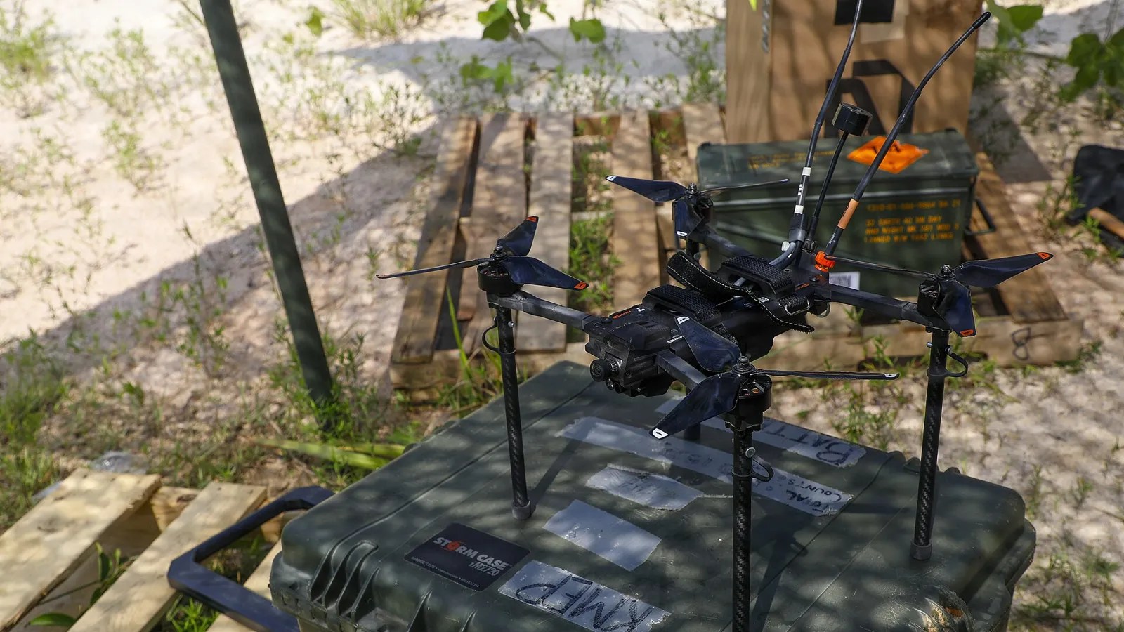 A small first-person-view drone on an equipment case at a U.S. Army range, the type of aircraft bought through the Drone Dominance Program