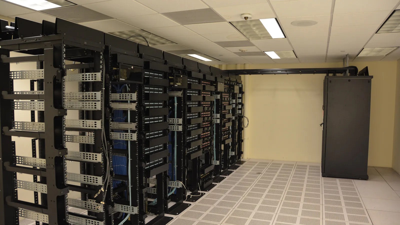 Rows of server racks in a data center, similar to the AI computing planned for the Nscale Loughton site in Essex.
