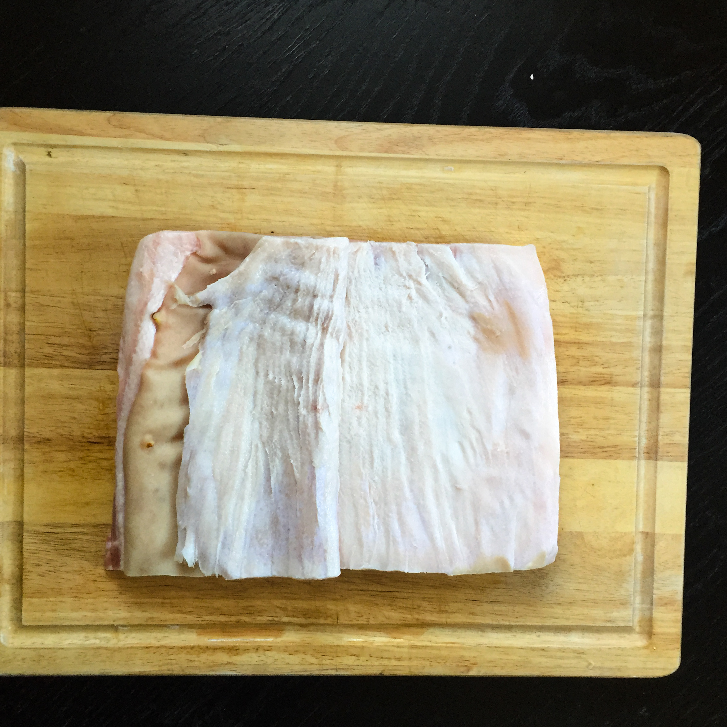 Pulling the skin back helps you get a good clean trim with your filet knife.