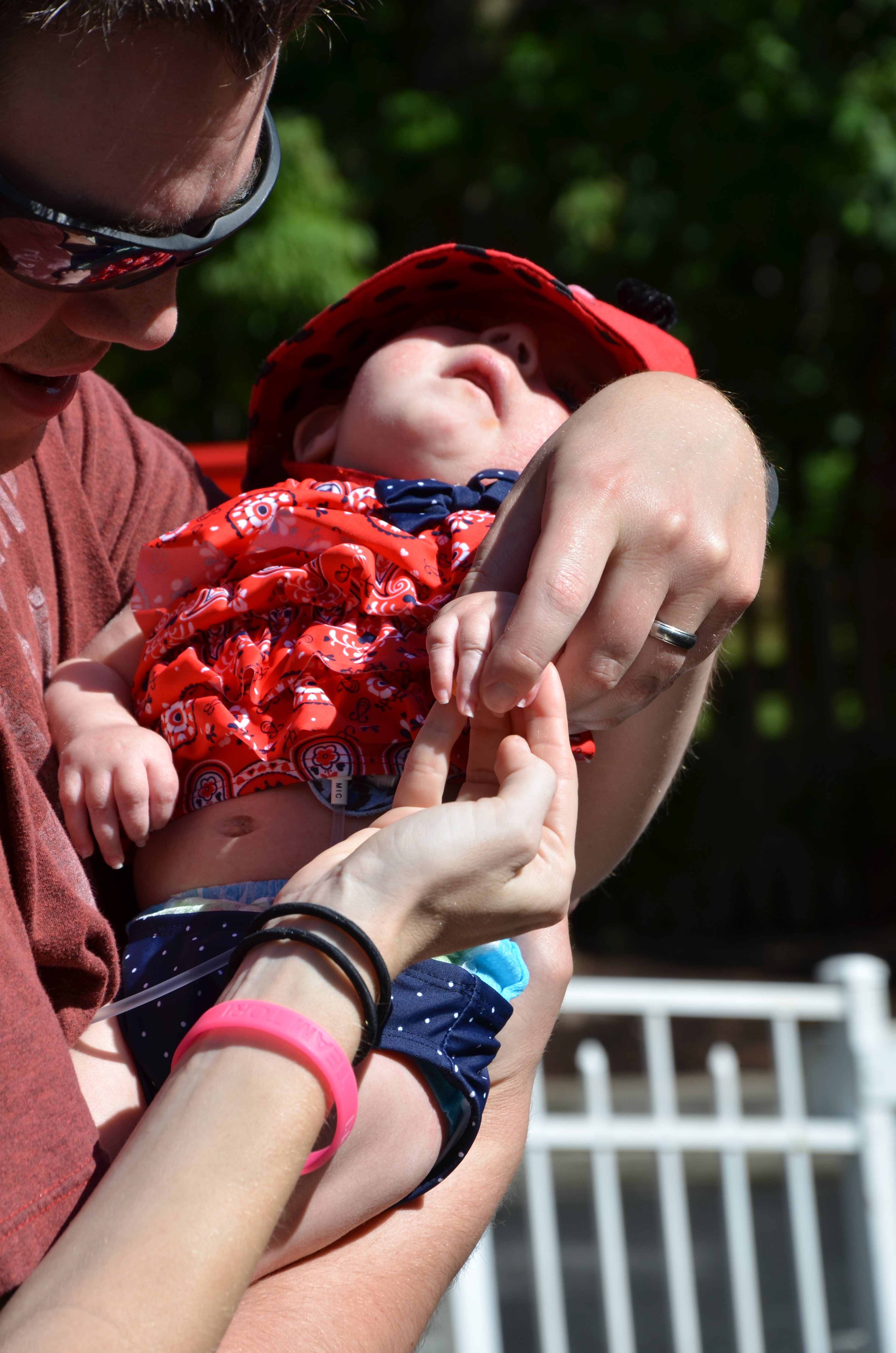 Putting it in her hand...