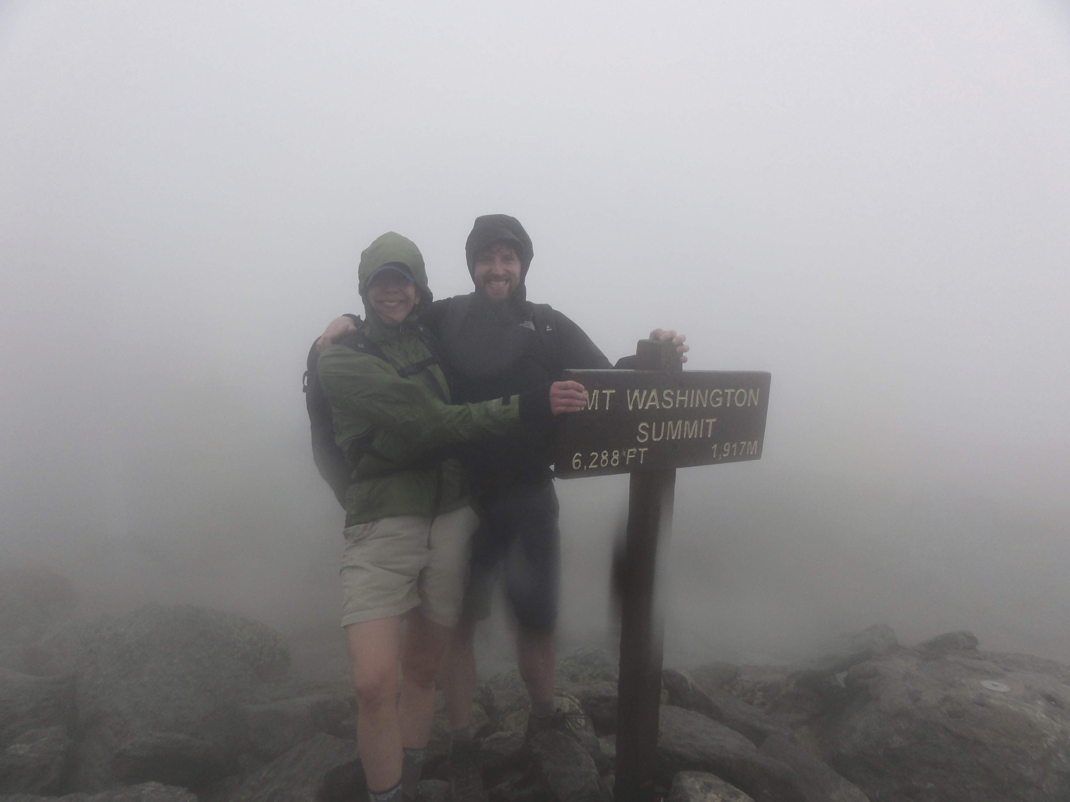 Using the summit sign for support.