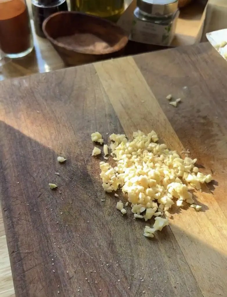 minced garlic on cutting board
