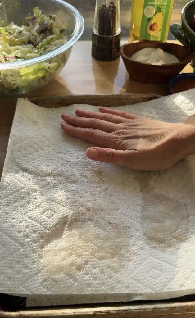 hand patting paper towel