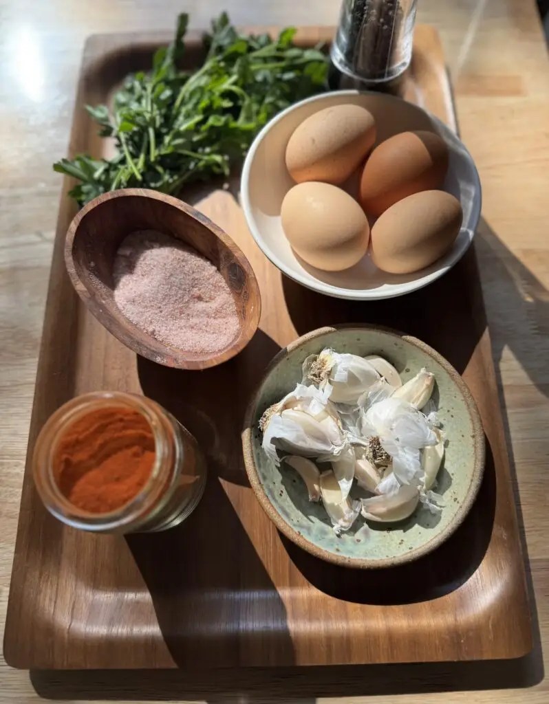 Ingredients needed to make homemade chicken schnitzel.