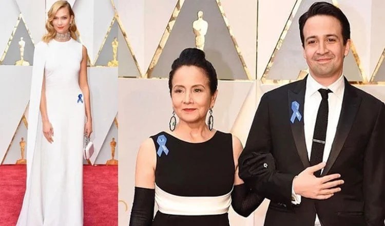 Why A-Listers Are Wearing Blue Ribbons To The Oscars