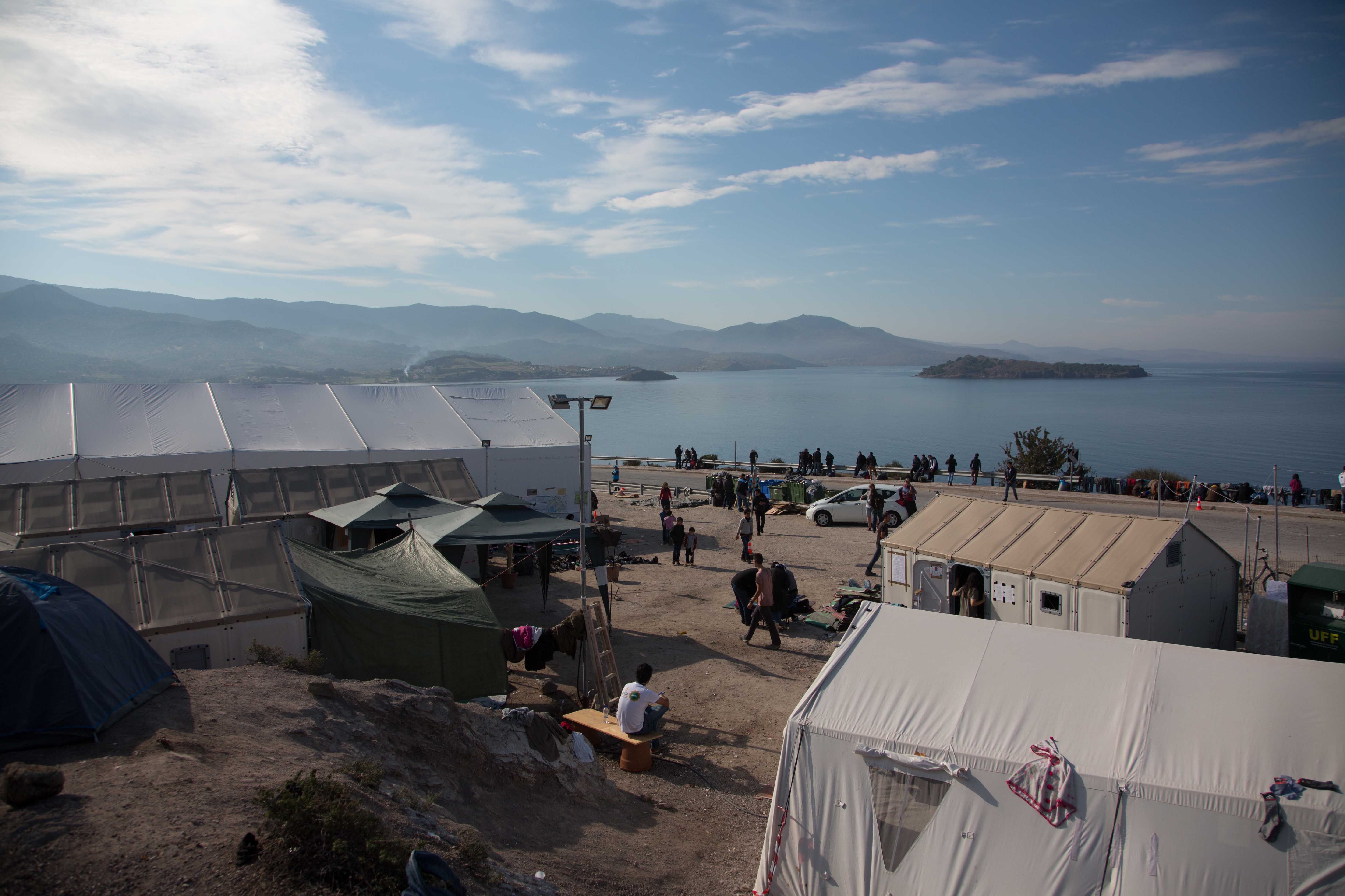 Morning at Camp OXY, a transition camp where people are fed clothed and put on bus's to processing camps near the main port.