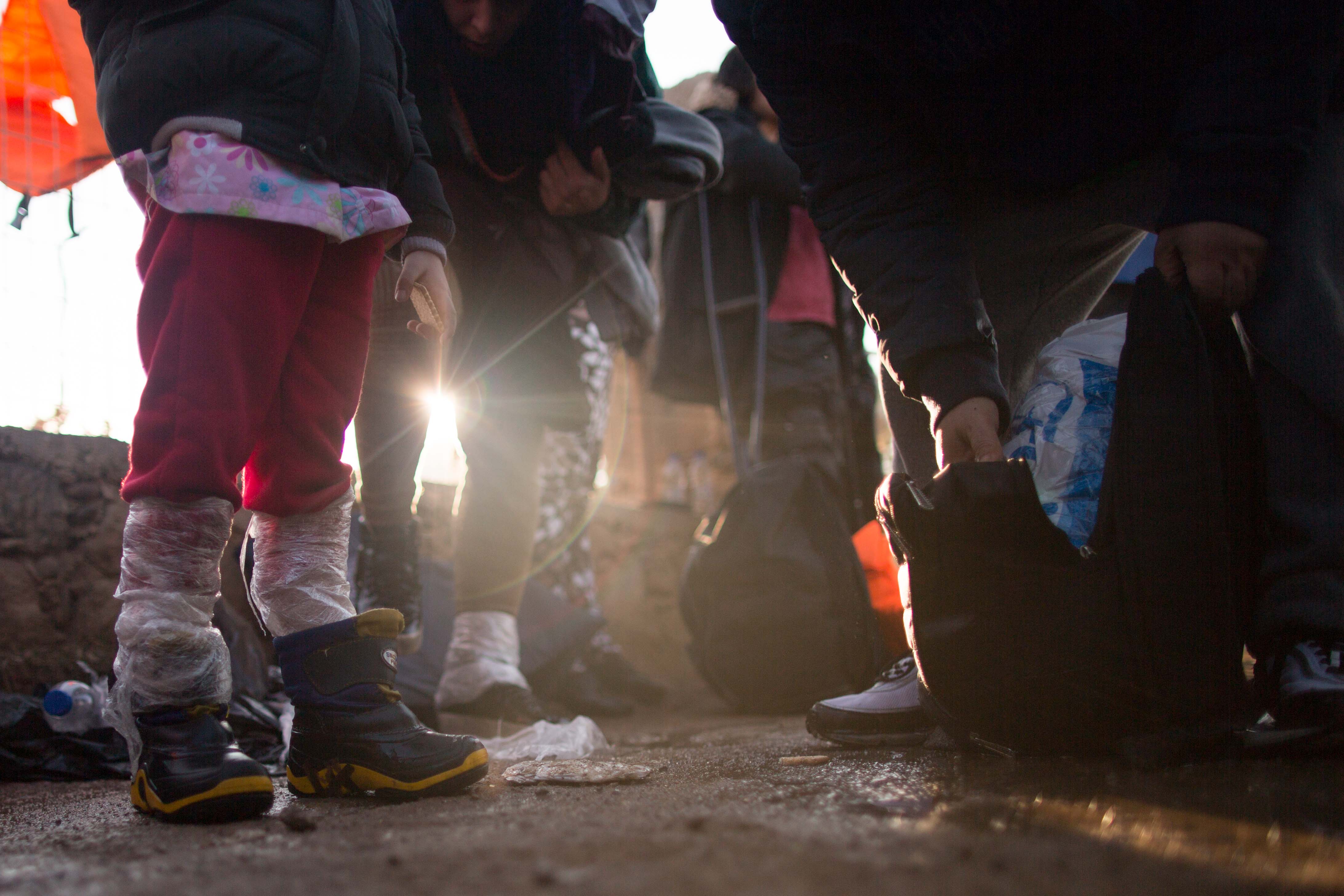 Every method imaginable is used to protect children and goods from the cold and wet on the 10 km passage from Turkey to Greece.