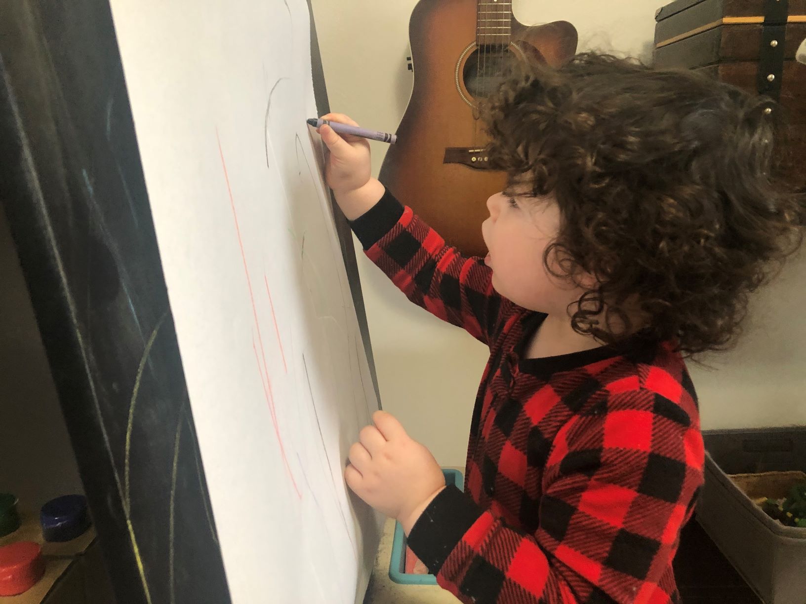 drawing sensory play at an easel