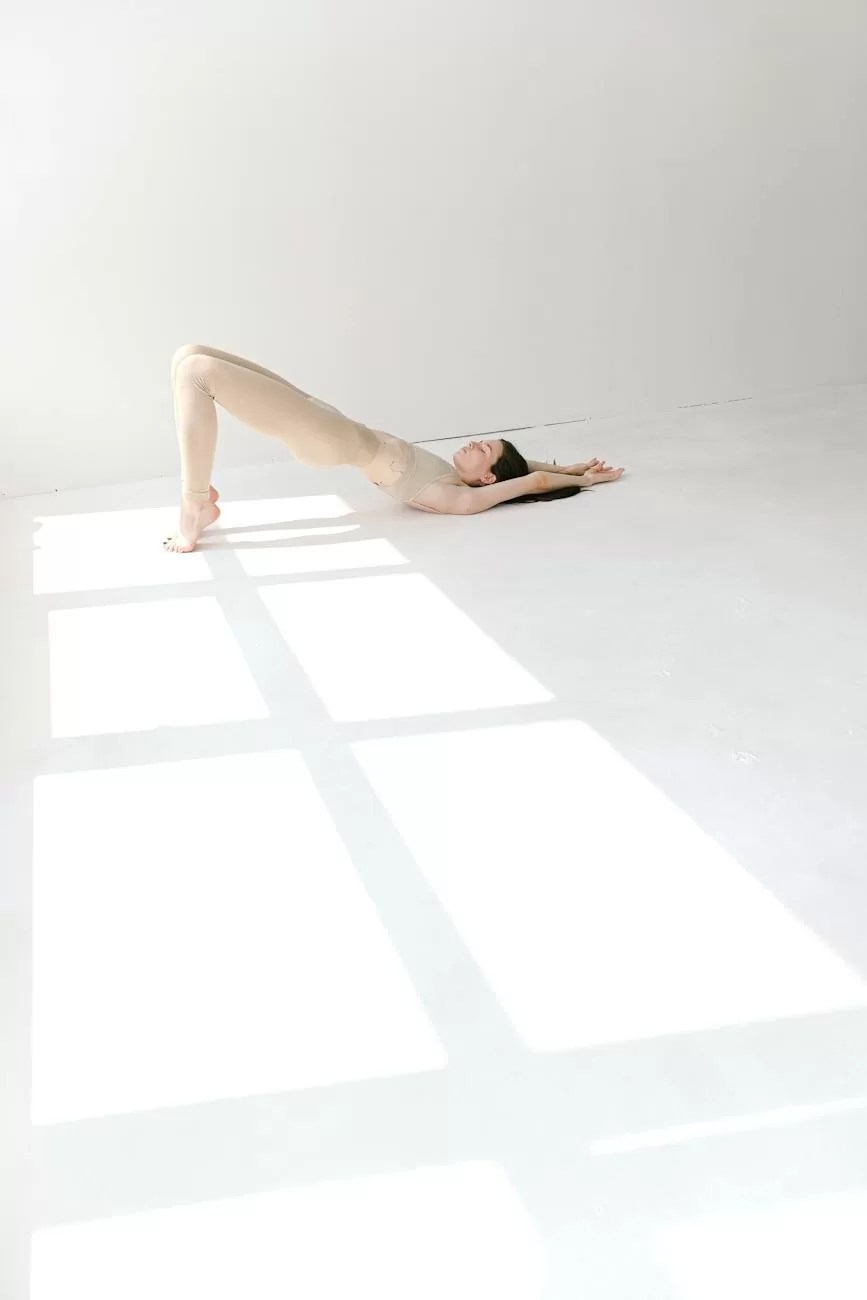 flexible slim woman doing bridge yoga asana on toes in sunny studio