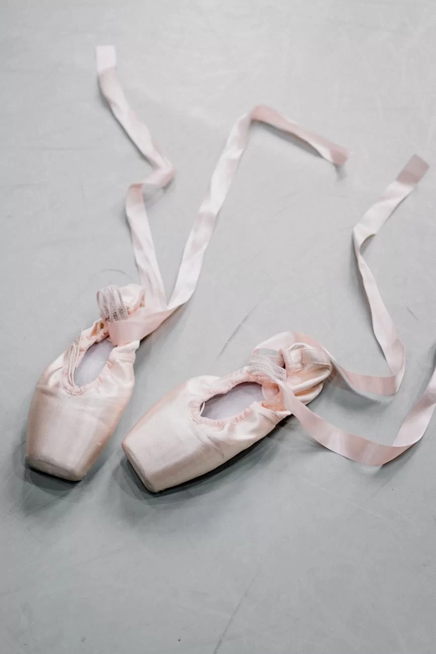 pointe shoes with silk ribbon on floor