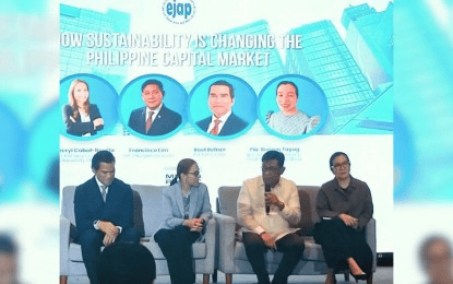 Panel discussion on sustainability's impact on the Philippine capital market, featuring five speakers on stage.