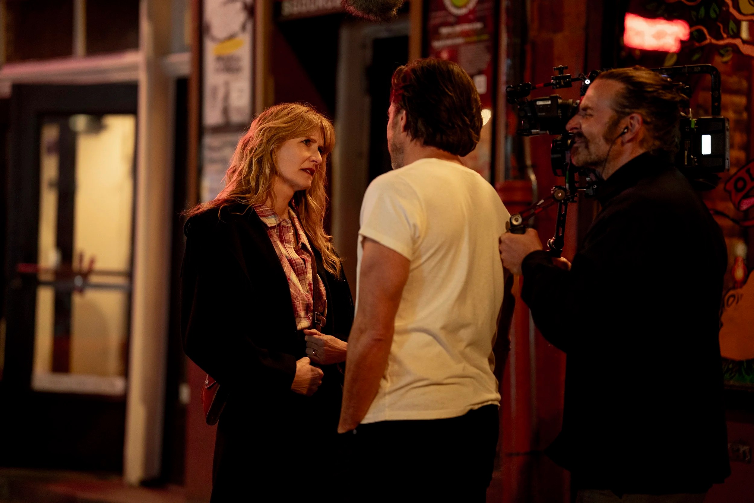 Laura Dern and Will Arnett with director Bradley Cooper on the set of IS THIS THING ON? - Photo by Searchlight Pictures/Jason McDonald,