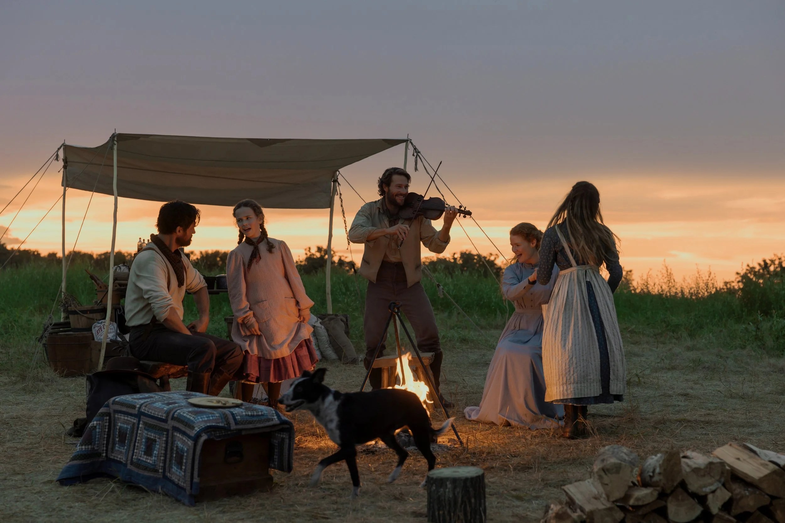 Little House on the Prairie. (L to R) Warren Christie as John Edwards, Alice Halsey as Laura Ingalls, Luke Bracey as Charles Ingalls, Crosby Fitzgerald as Caroline Ingalls, Skywalker Hughes as Mary Ingalls in episode 102 of Little House on the Prairie. Cr. Eric Zachanowich/Netflix © 2026