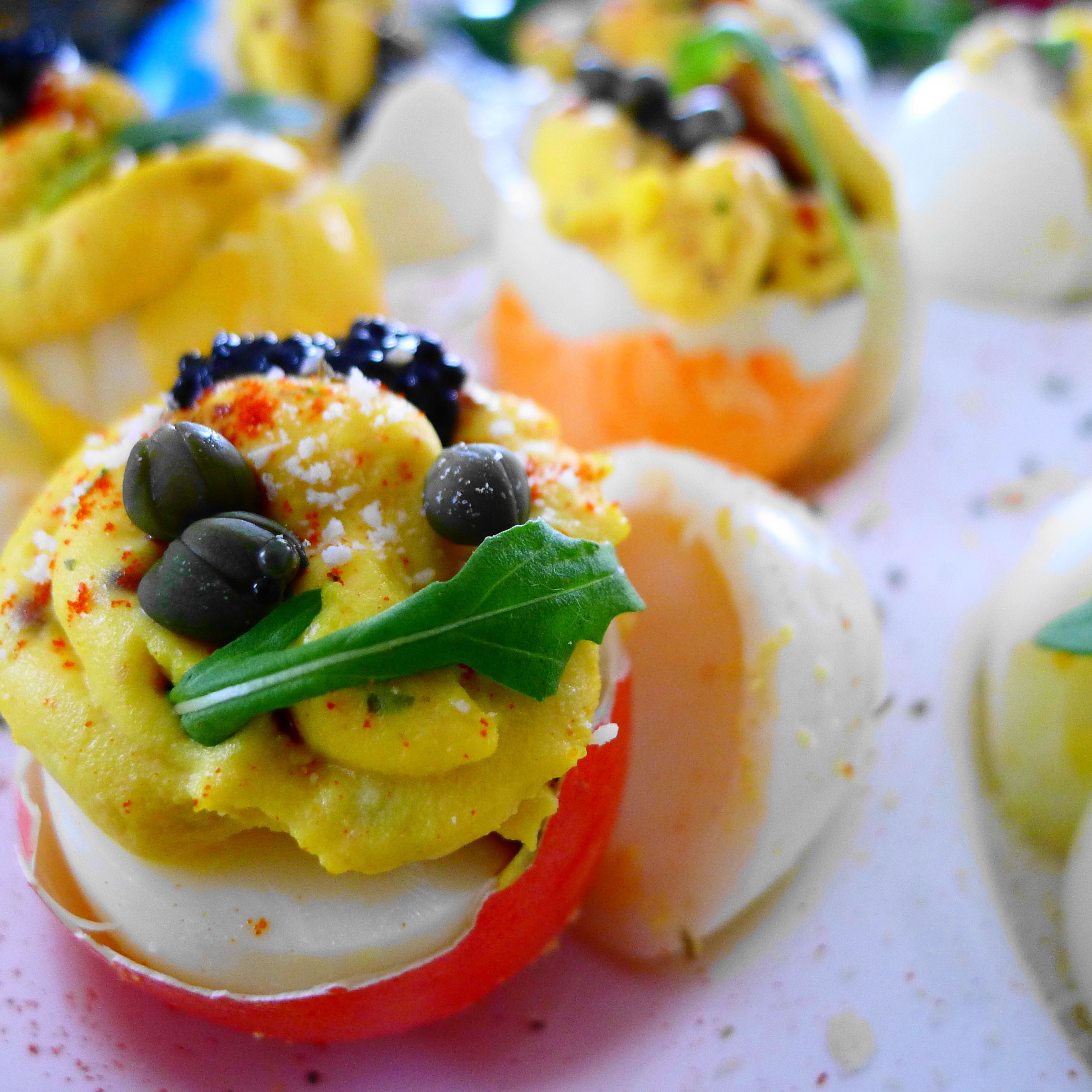 Arugula, Caviar, and Capers Deviled Egg with Paprika, Parmesan and White Truffle Balsamic Glaze