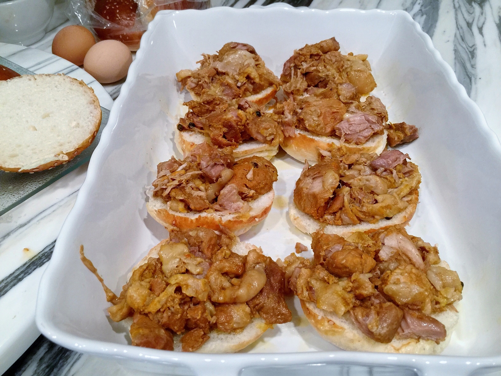 Skim the fat and place adobo over buns