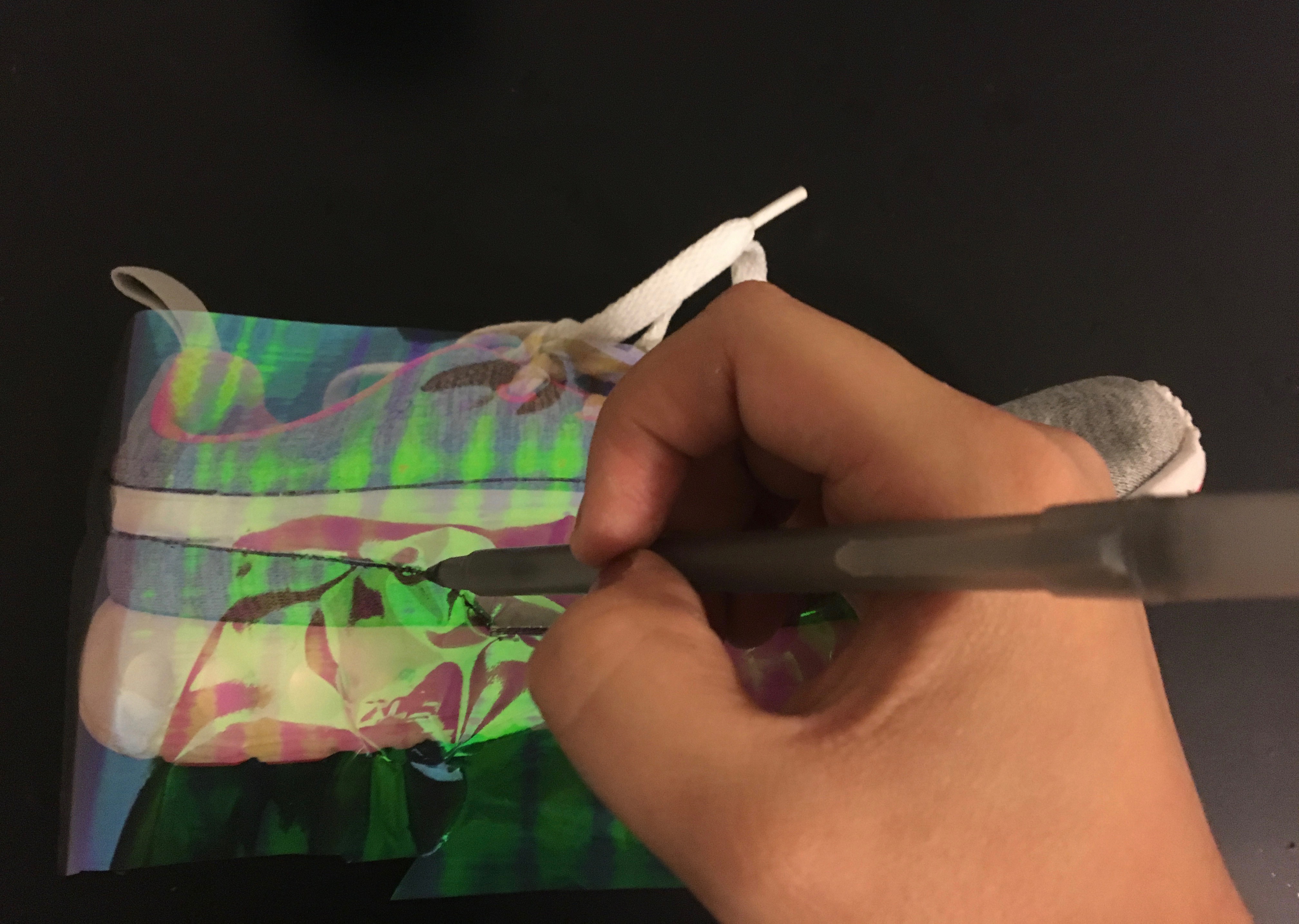 slightly press with a pen to outline the shape