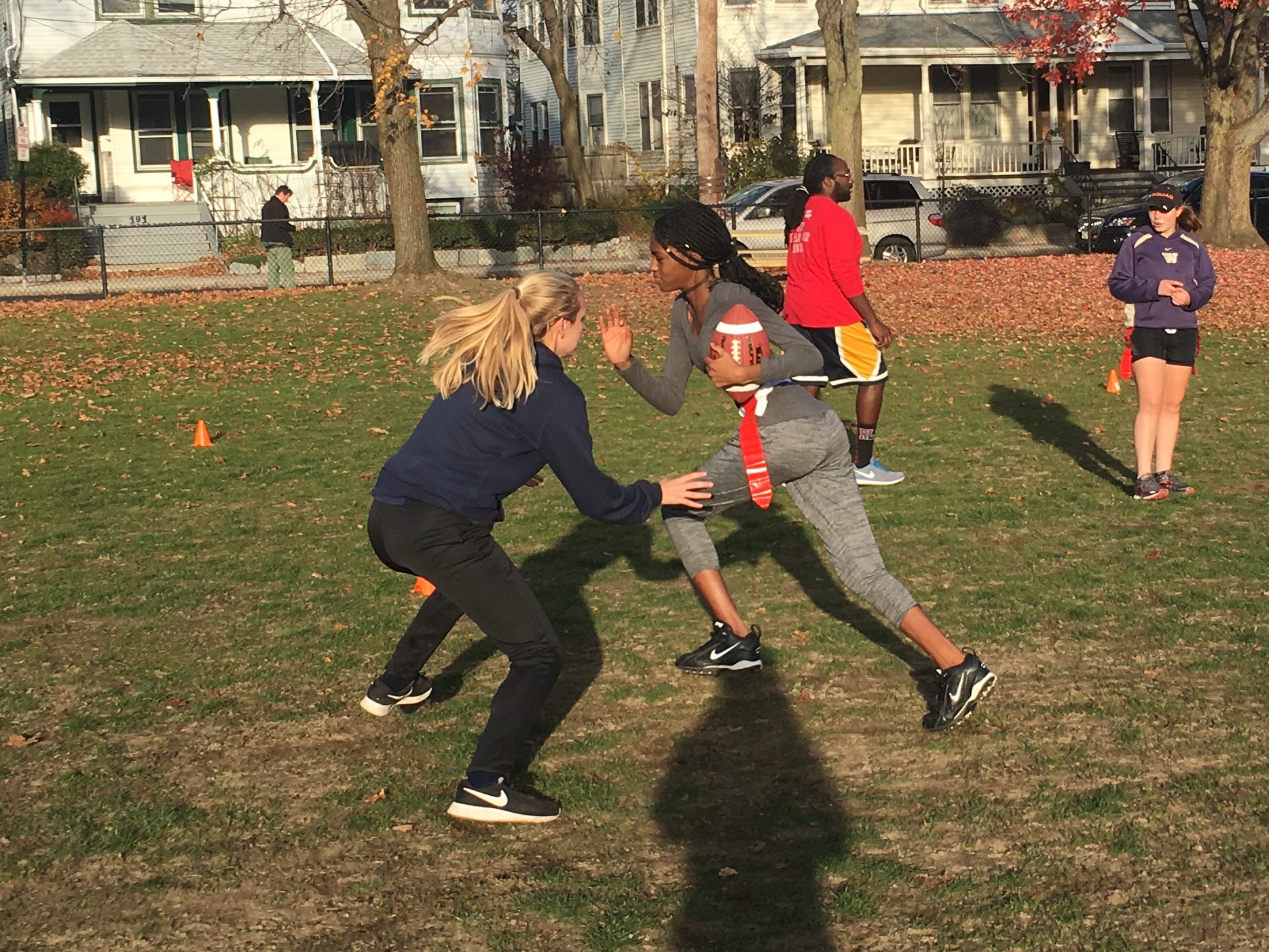 Juniors Maya Shaughnessy and Juliette Estime practice defense drills during Powderpuff practice at Cypress field. 