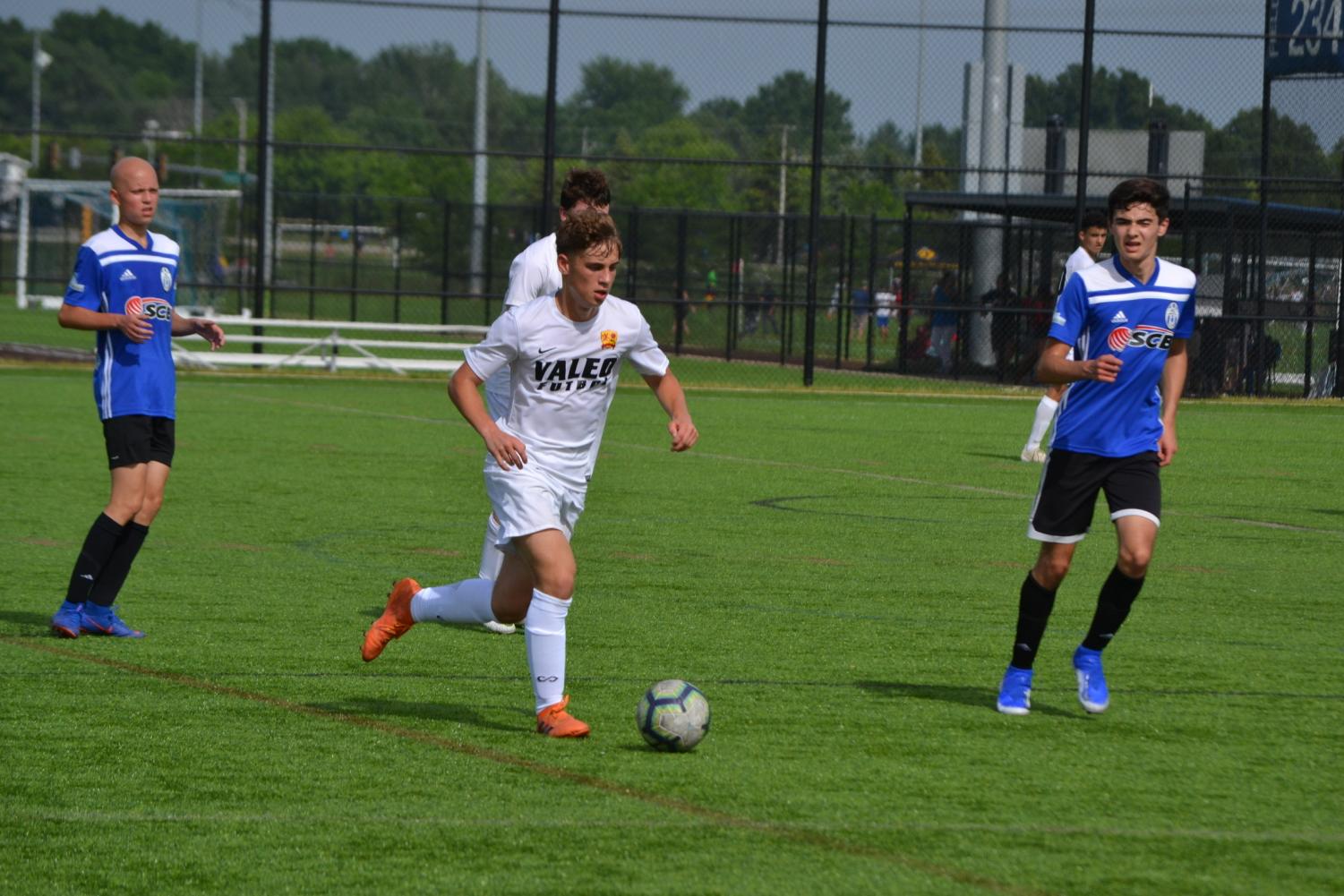 Senior and captain of boys varsity soccer, Rex Feldgoise (in white), sees strengths in each player that unite the team. 
